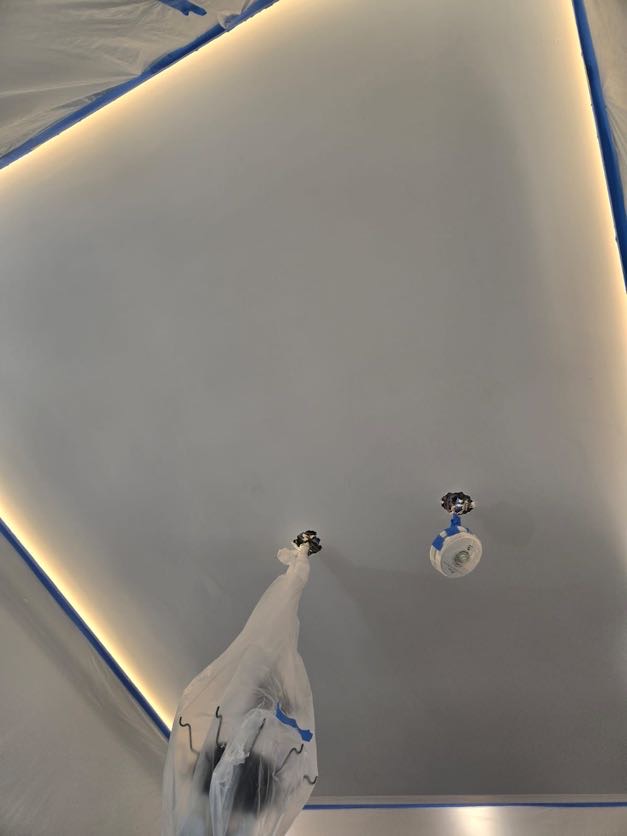 Freshly painted smooth ceiling with LED lighting