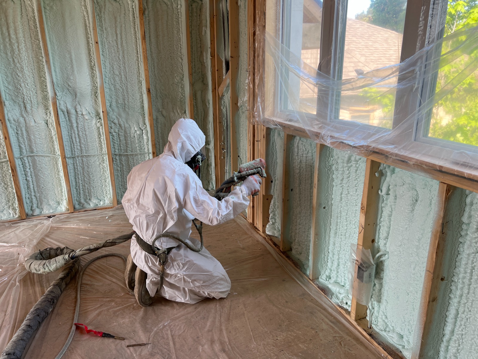 Spray foam installer at work