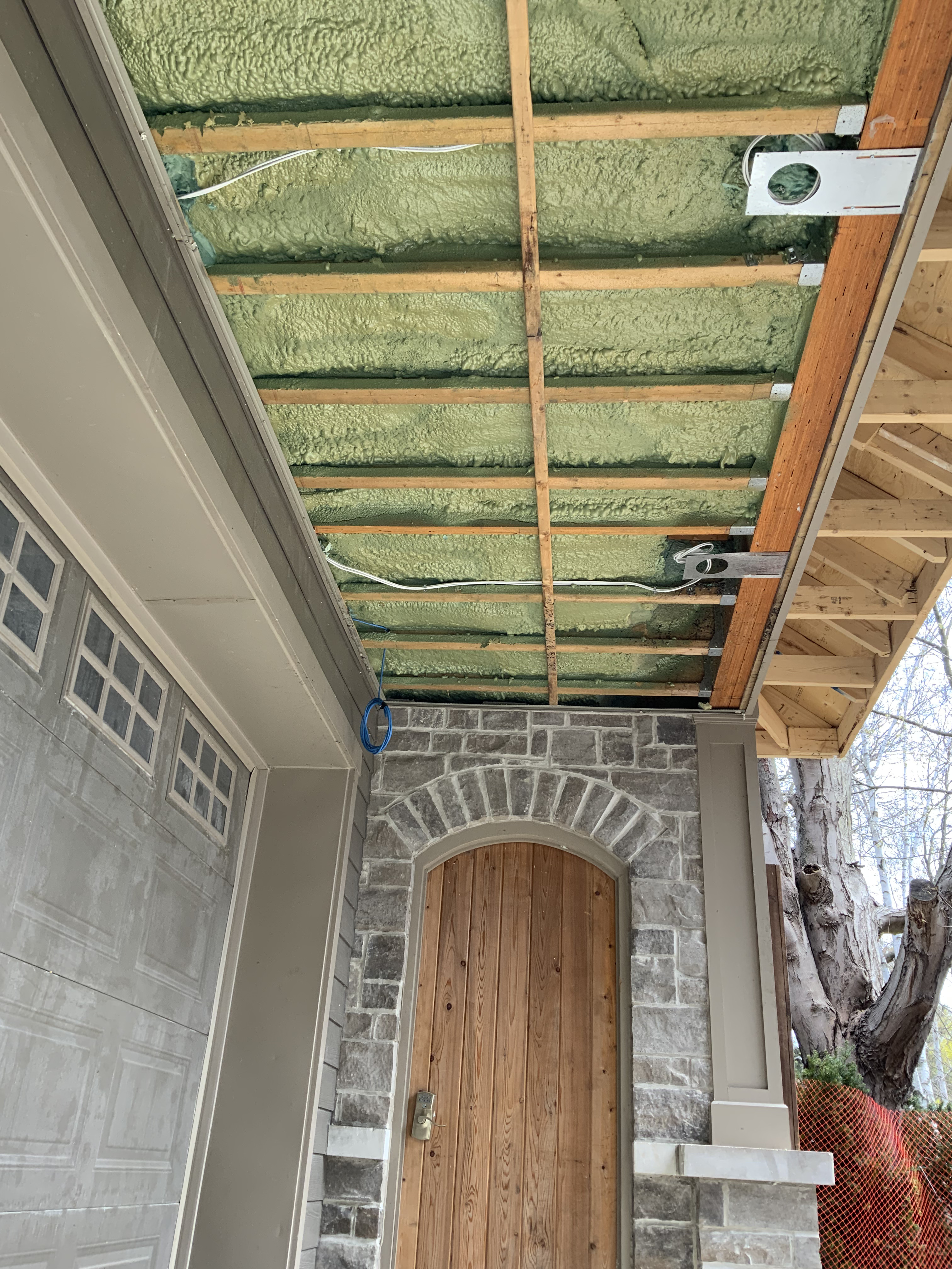 Spray foam insulation being applied in a construction project
