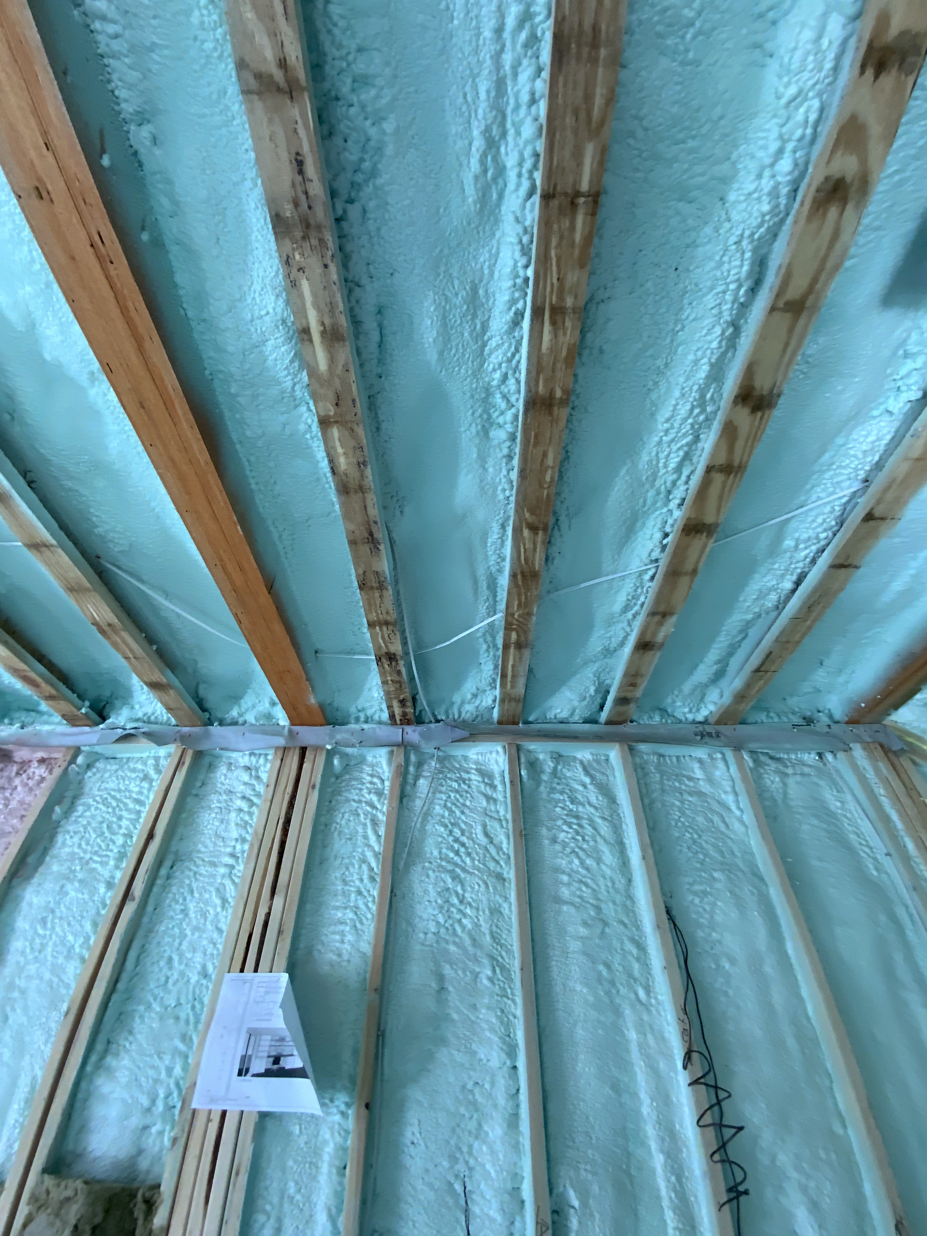 Surface preparation for spray foam